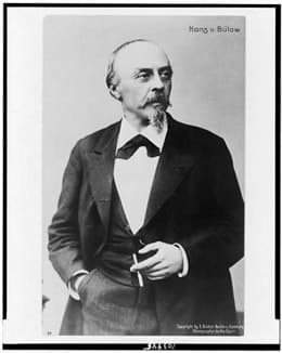 Hans von Bülow, as photographed by Leonhard Berlin-Bieber (1841-1931) between 1880 and 1894.